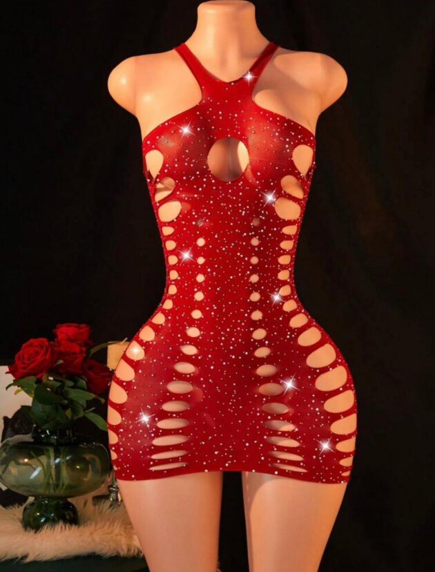 Red rhinestone fishnet mini dress lingerie with side cutouts, front keyhole design, and sparkling crystal embellishments displayed on a mannequin.